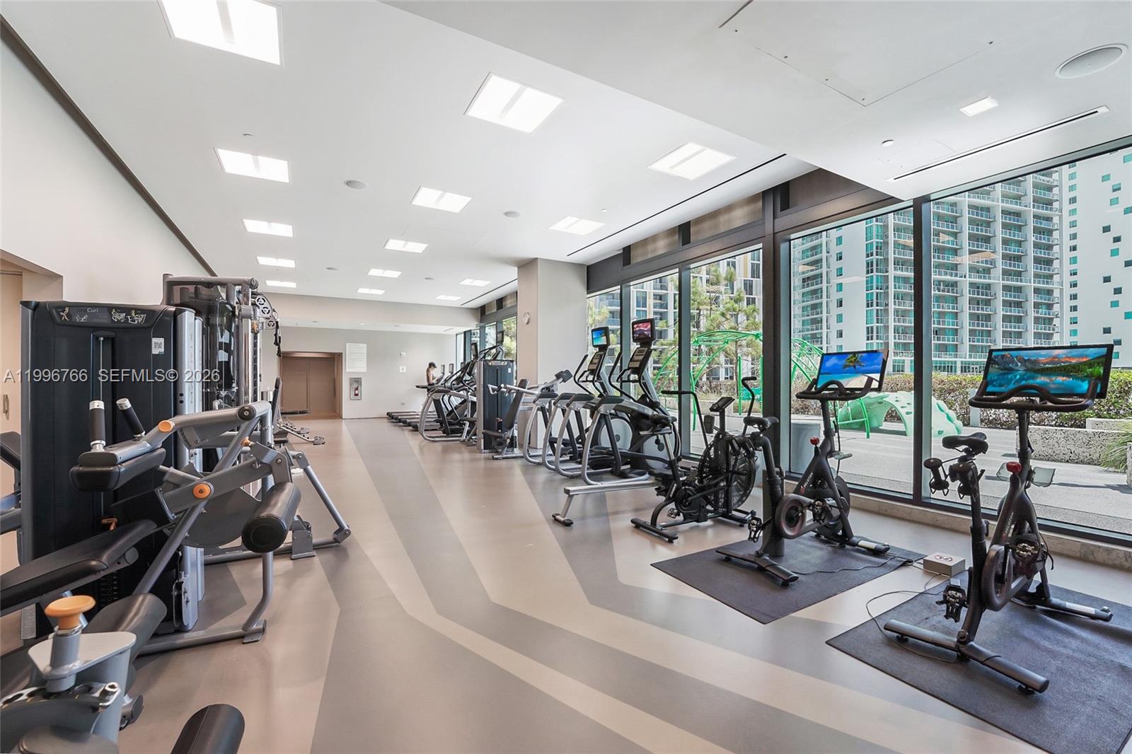 68 Southeast 6th Street, Unit 2104 Miami, FL 33131 - Photo 17 of 33 a view of a room with gym equipment
