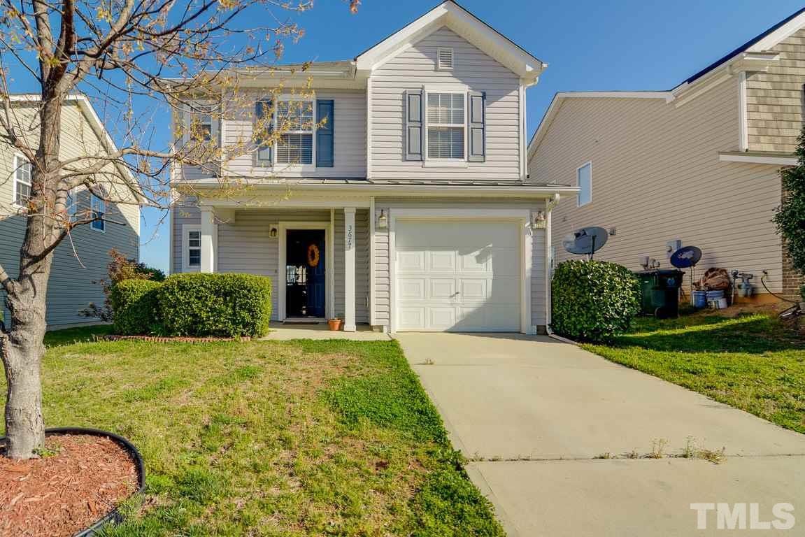 3677 Marshlane Way Raleigh, NC 27610 - Photo 2 of 24 a front view of a house with garden