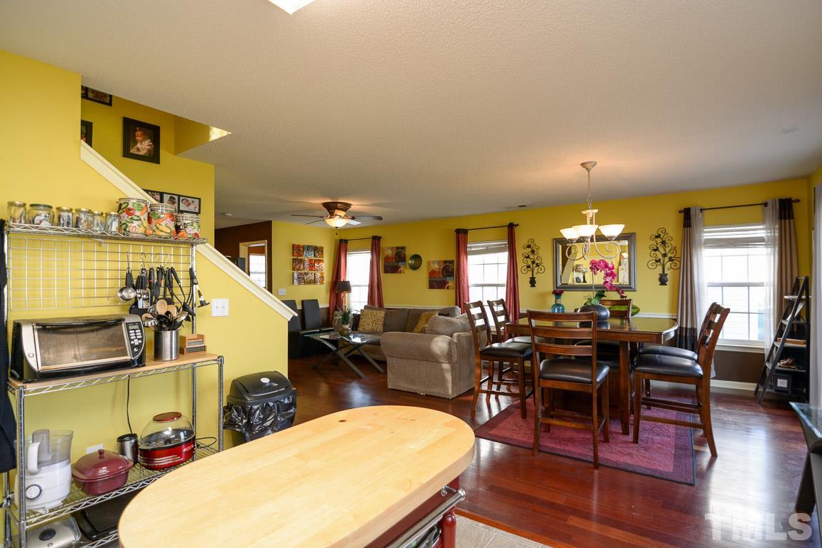 3677 Marshlane Way Raleigh, NC 27610 - Photo 13 of 24 a view of a dining room with furniture window and wooden floor