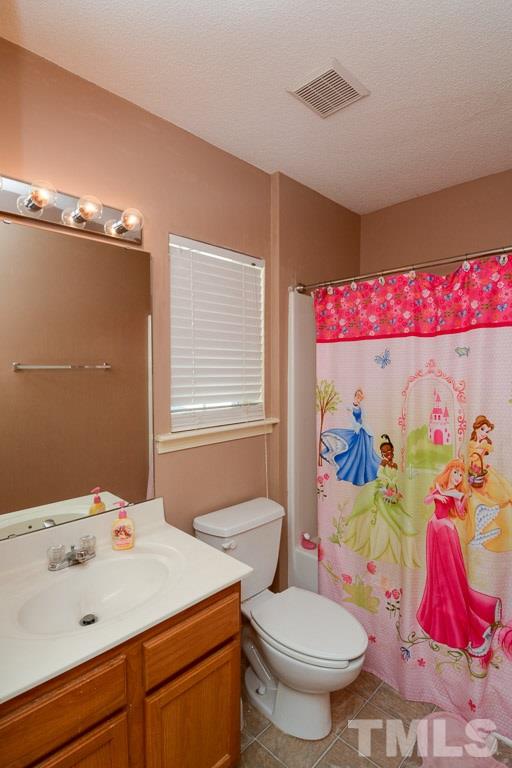 3677 Marshlane Way Raleigh, NC 27610 - Photo 15 of 24 a bathroom with a sink toilet vanity and tub