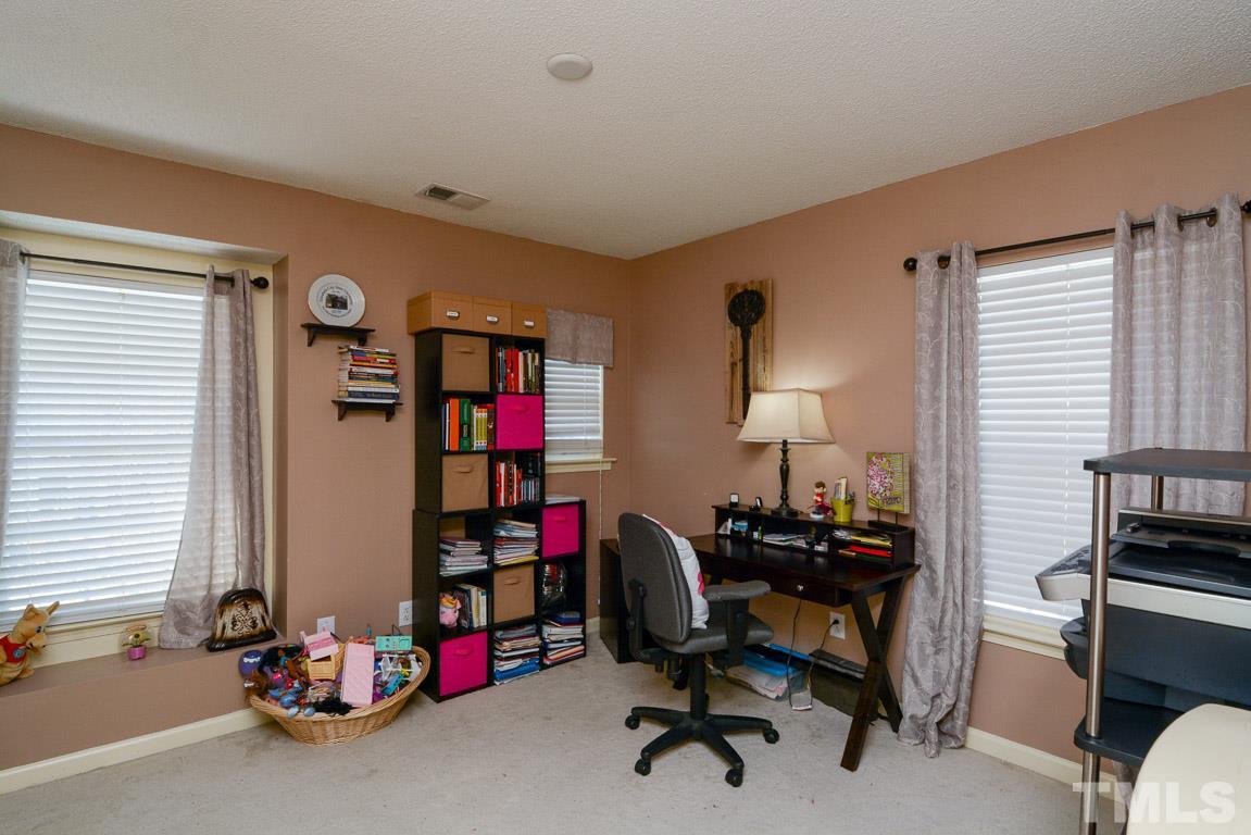 3677 Marshlane Way Raleigh, NC 27610 - Photo 16 of 24 a view of a workspace with gym equipment
