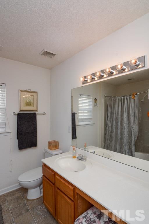 3677 Marshlane Way Raleigh, NC 27610 - Photo 19 of 24 a bathroom with a sink toilet and mirror