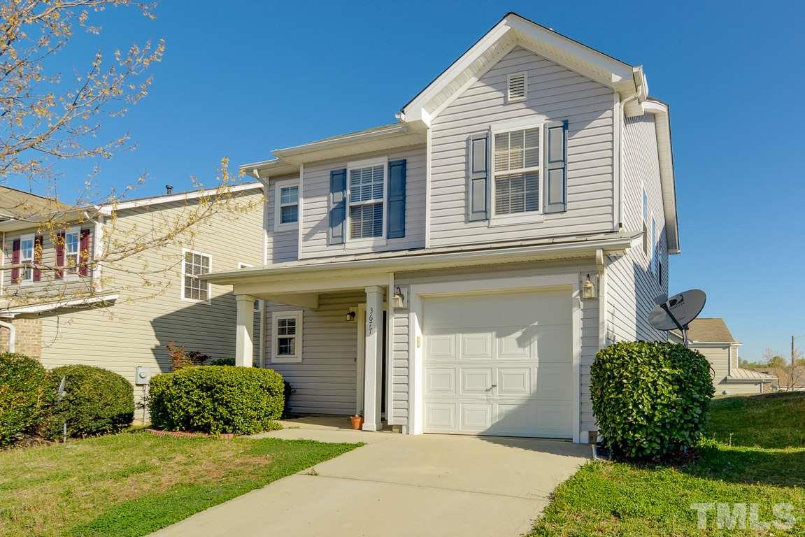 3677 Marshlane Way Raleigh, NC 27610 - Photo 3 of 24 a front view of a house with a yard