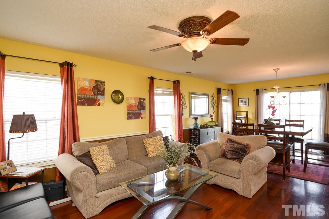 3677 Marshlane Way Raleigh, NC 27610 - Photo 4 of 24 a living room with furniture and a large window