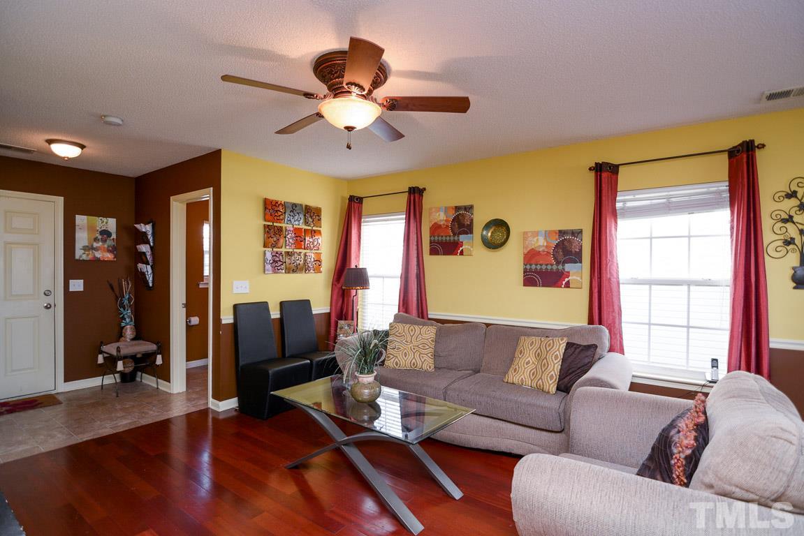 3677 Marshlane Way Raleigh, NC 27610 - Photo 5 of 24 a living room with furniture and a large window
