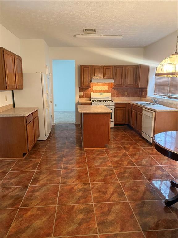 682 Bridge Way Lithonia, GA 30058 - Photo 6 of 25 a kitchen with a sink a counter space and cabinets