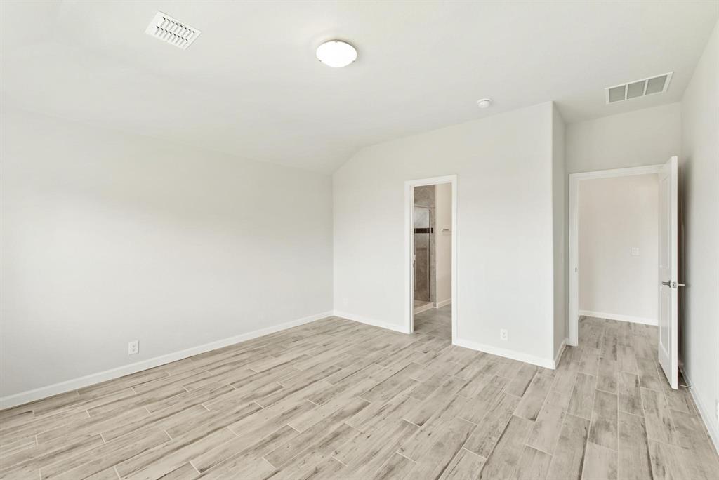 920 Elk Ridge Run Godley, TX 76044 - Photo 6 of 34 Spacious room with wood-finish flooring, light neutral wall tones, and recessed lighting