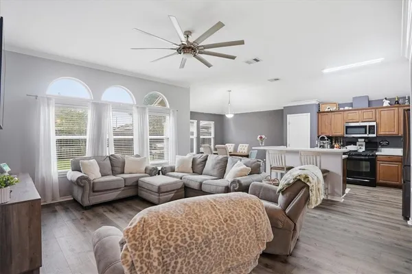 a living room with furniture and a large window
