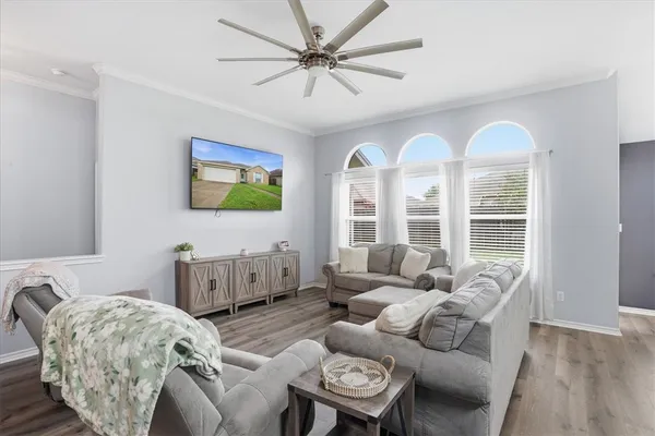 a living room with furniture and a large window