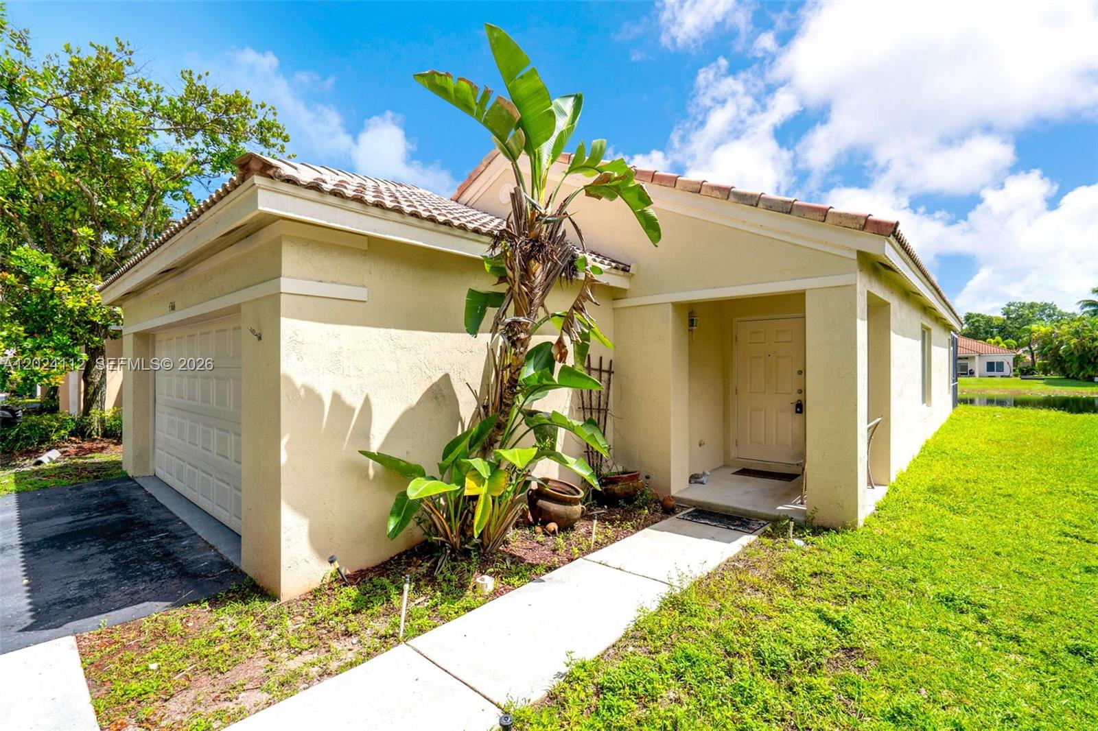 4366 Mahogany Ridge Drive Weston, FL 33331 - Photo 3 of 41 a view of a house with a yard