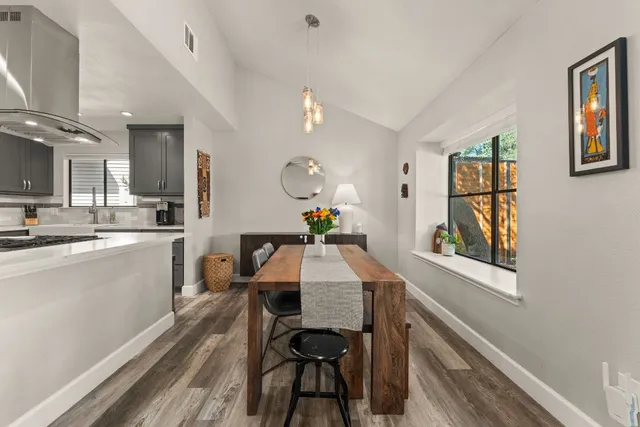 a bathroom with double sink and a mirror