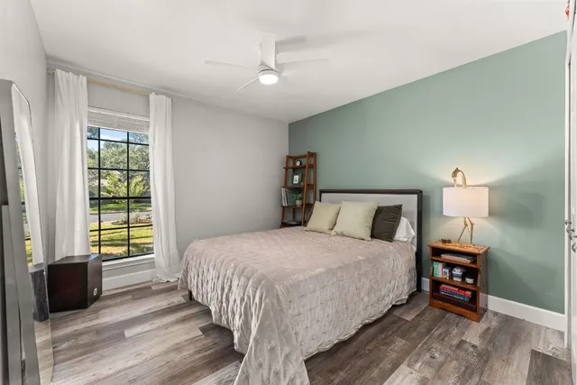 a bathroom with a sink a toilet and shower curtain