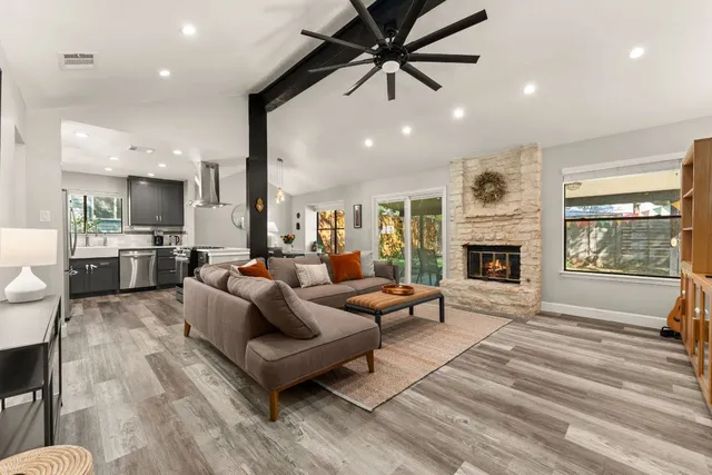 a living room with furniture and a fireplace