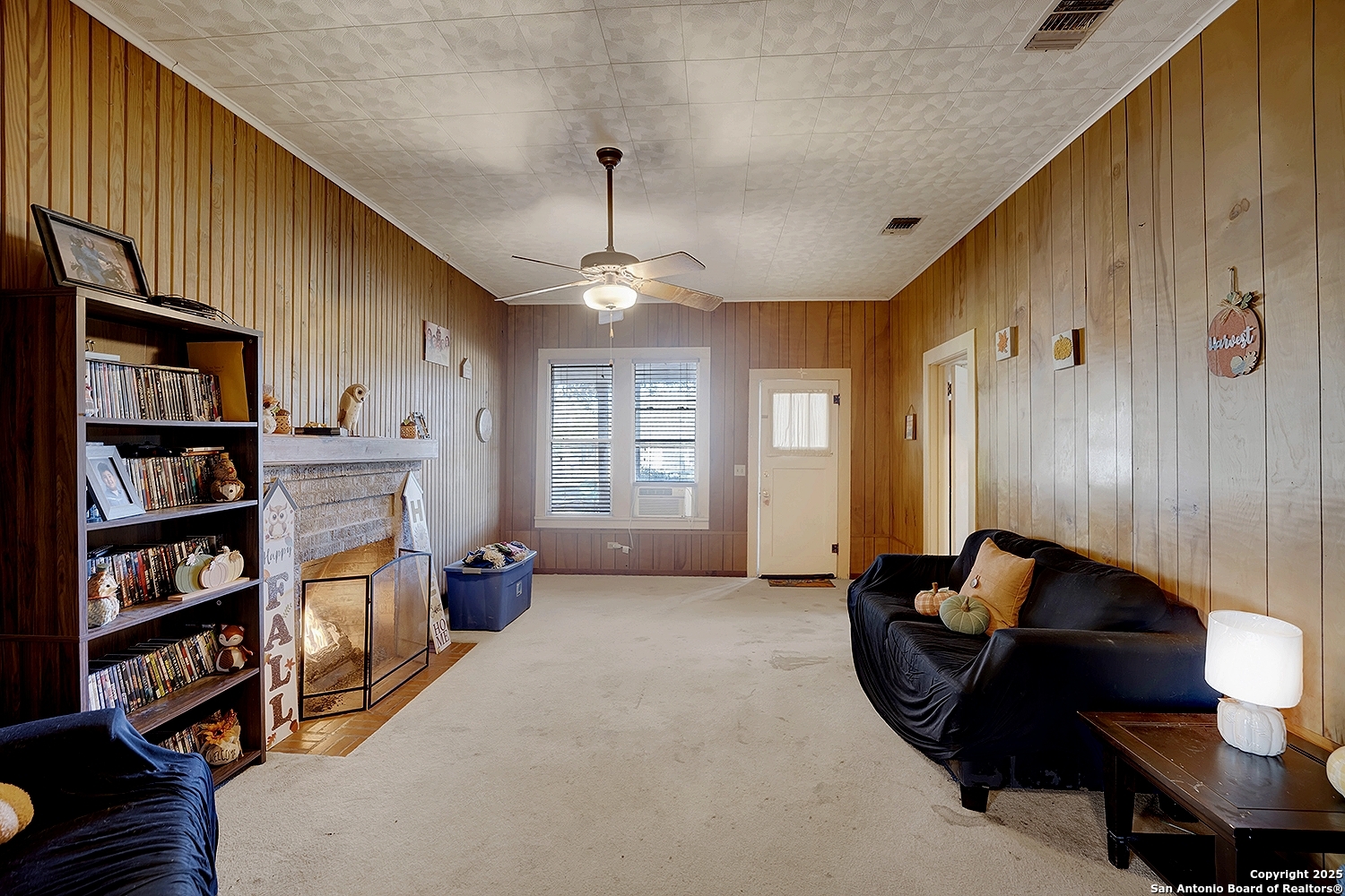 612 East Guadalupe Street Runge, TX 78151 - Photo 15 of 44 a living room with furniture and a book shelf