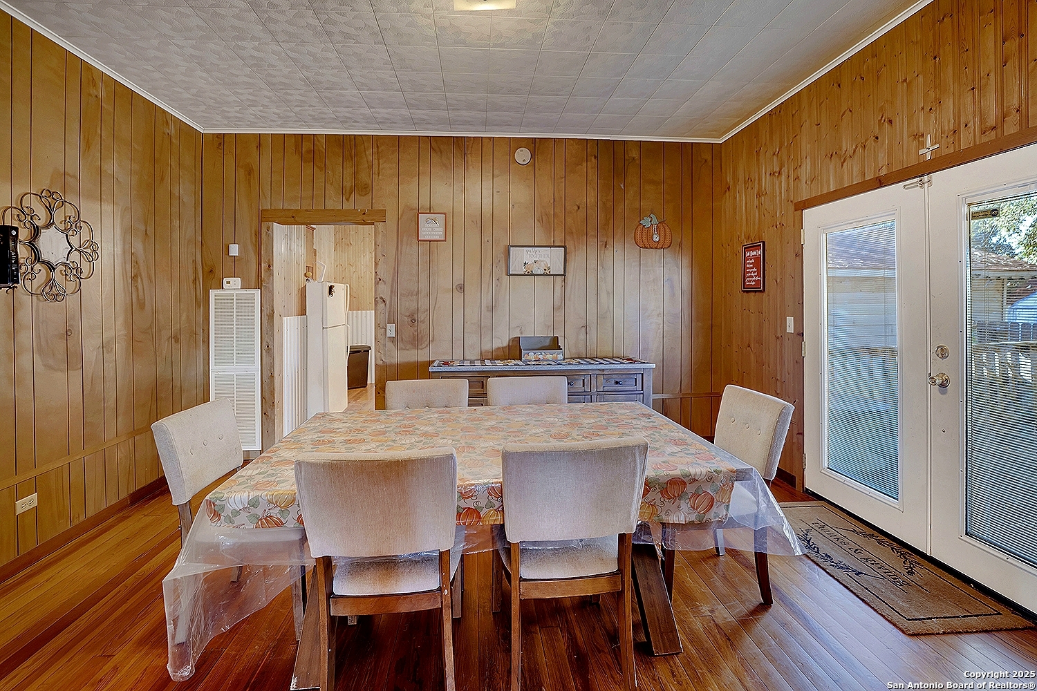 612 East Guadalupe Street Runge, TX 78151 - Photo 16 of 44 a view of a dining room with furniture and wooden floor