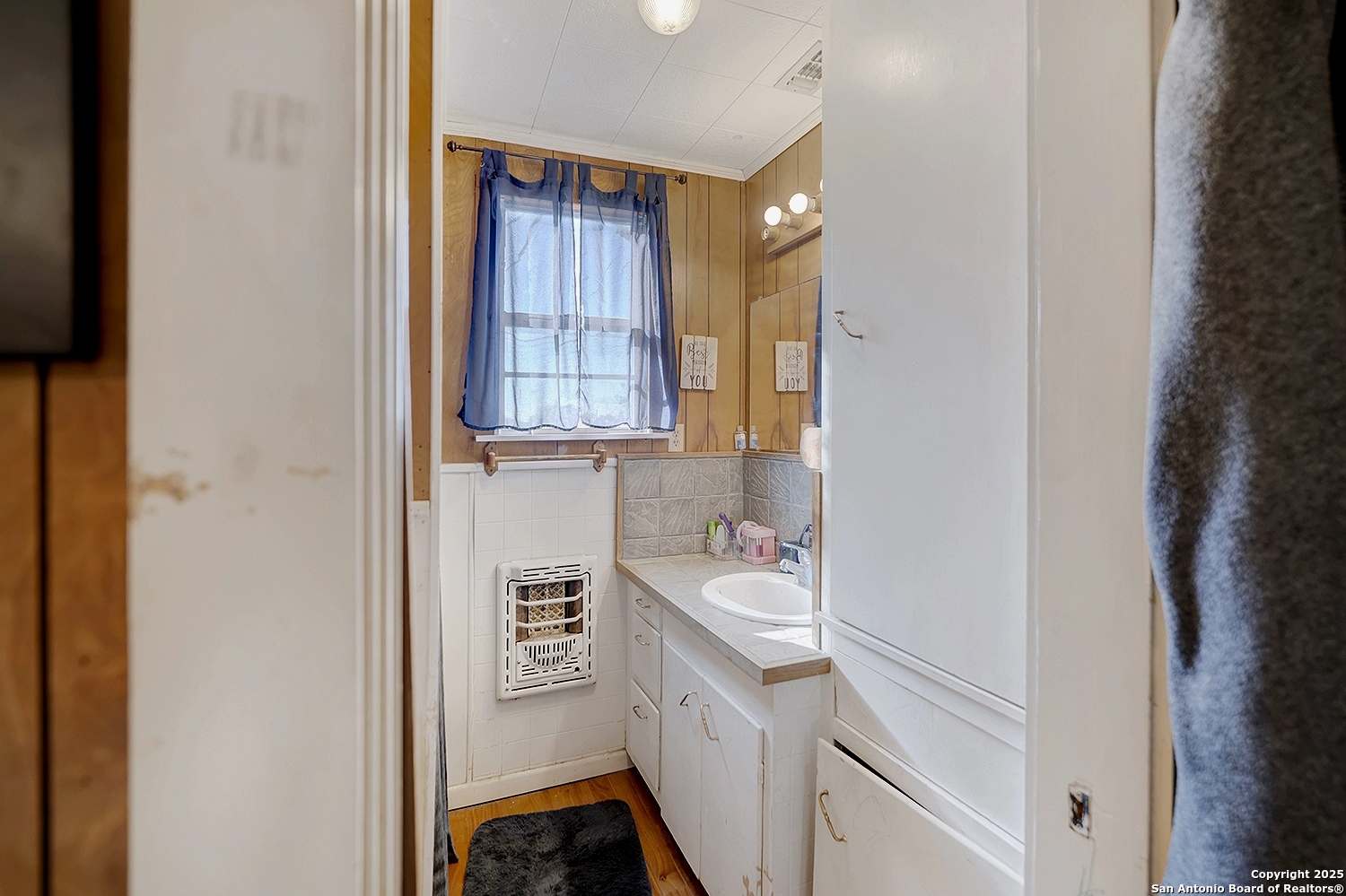 612 East Guadalupe Street Runge, TX 78151 - Photo 24 of 44 a bathroom with a sink a vanity and a mirror