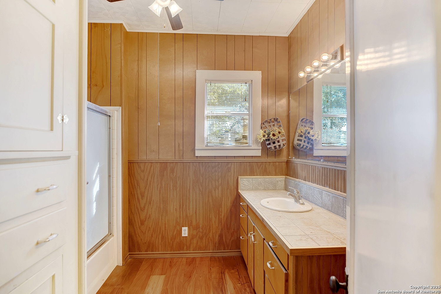 612 East Guadalupe Street Runge, TX 78151 - Photo 28 of 44 a bathroom with a sink a mirror and a shower