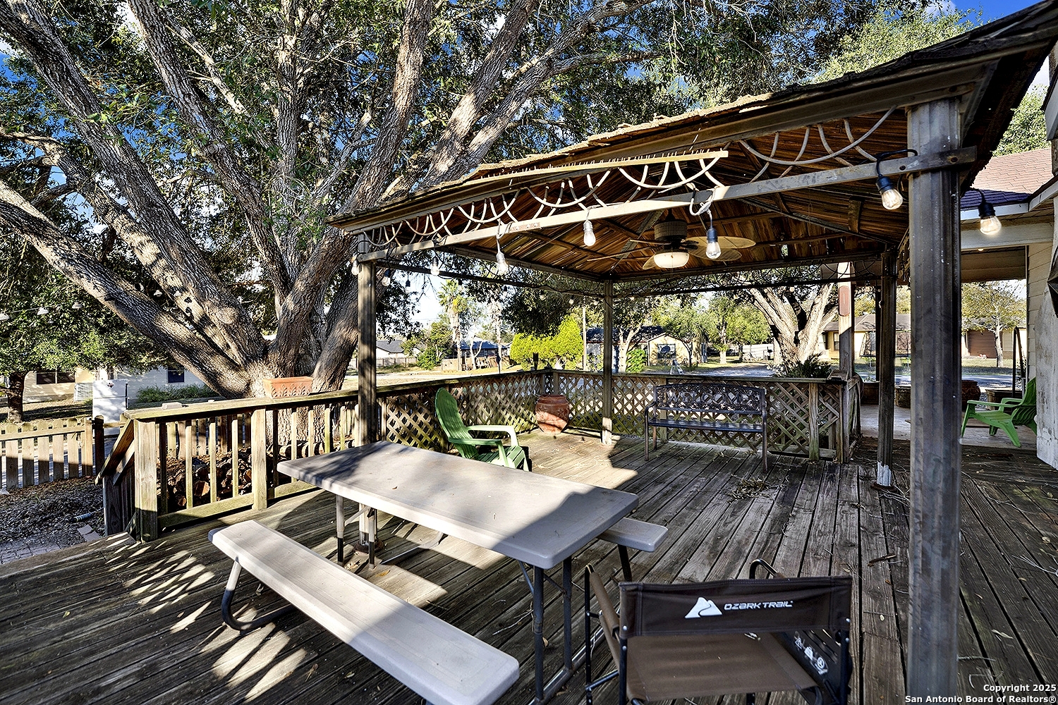 612 East Guadalupe Street Runge, TX 78151 - Photo 30 of 44 a view of a chairs and table in patio with a barbeque