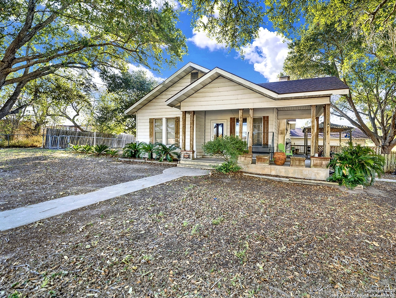 612 East Guadalupe Street Runge, TX 78151 - Photo 4 of 44 a front view of a house with garden