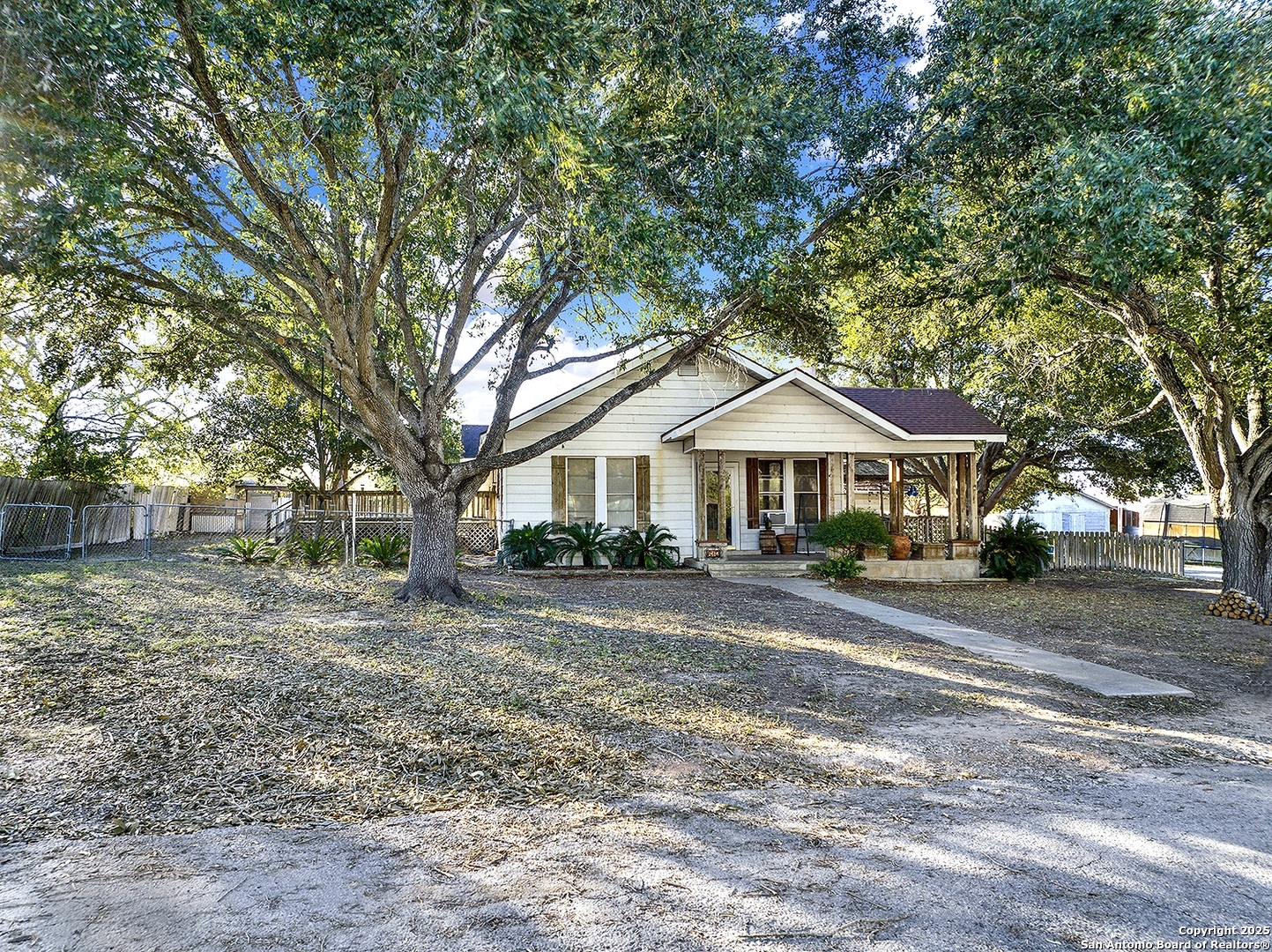 612 East Guadalupe Street Runge, TX 78151 - Photo 5 of 44 a front view of a house with yard