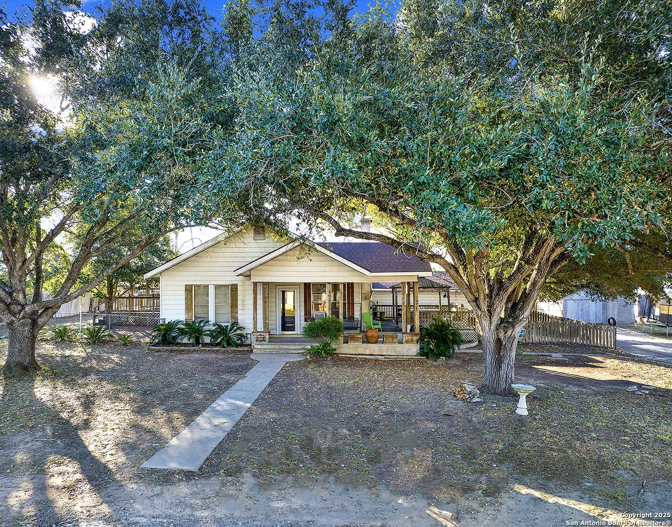 612 East Guadalupe Street Runge, TX 78151 - Photo 6 of 44 a front view of a house with a yard