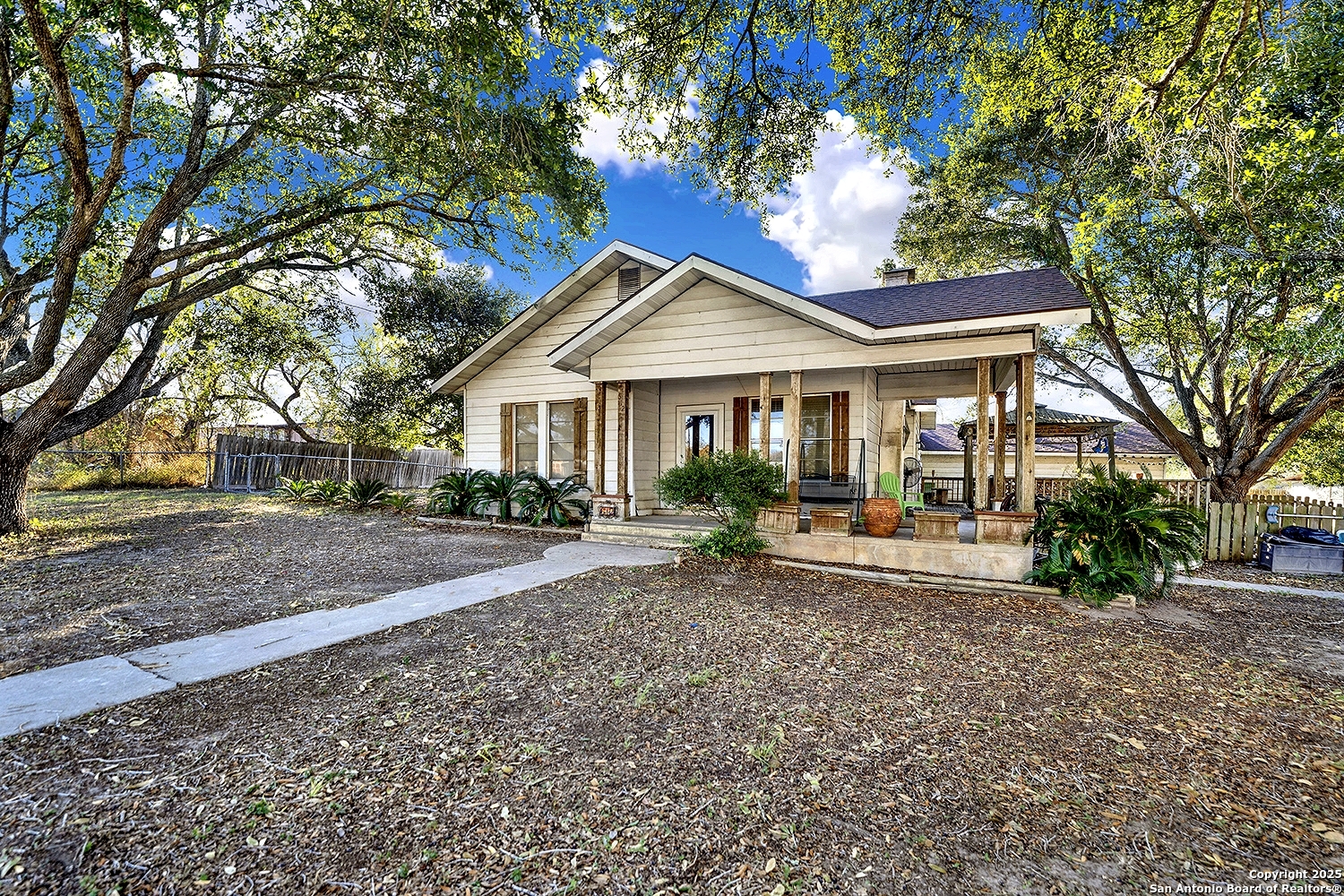 612 East Guadalupe Street Runge, TX 78151 - Photo 7 of 44 a front view of a house with a garden