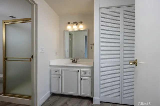 a bathroom with a double vanity and a mirror