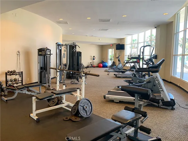 a view of a swimming pool and outside seating
