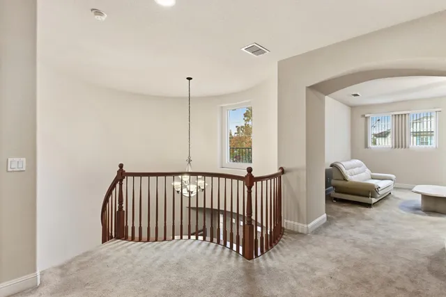 a view of a livingroom with furniture and windows