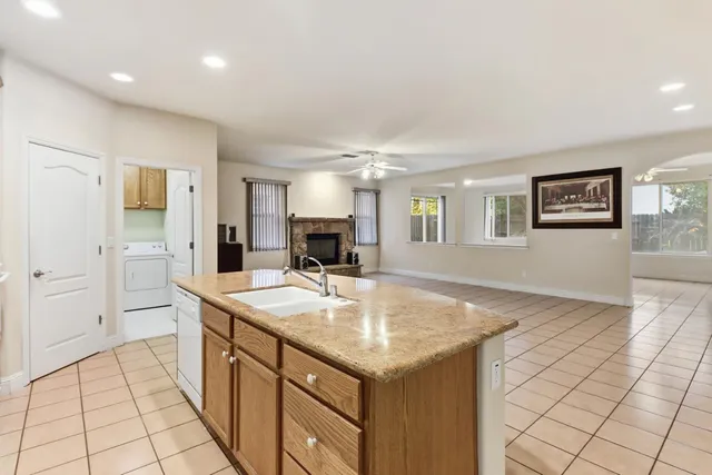 a kitchen with sink cabinets and stove