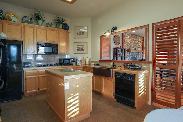 1050 Spring Road Shelter Cove, CA 95589 - Photo 32 of 42 a kitchen with stainless steel appliances granite countertop a stove and a sink