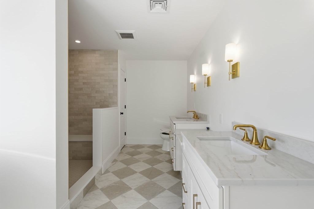 16 Couture Way Middleton, MA 01949 - Photo 24 of 36 a bathroom with a sink a toilet and shower
