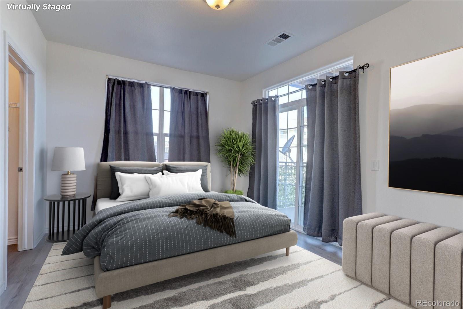 18657 Stroh Road, Unit 4107 Parker, CO 80134 - Photo 16 of 25 a bedroom with bed lamp and window