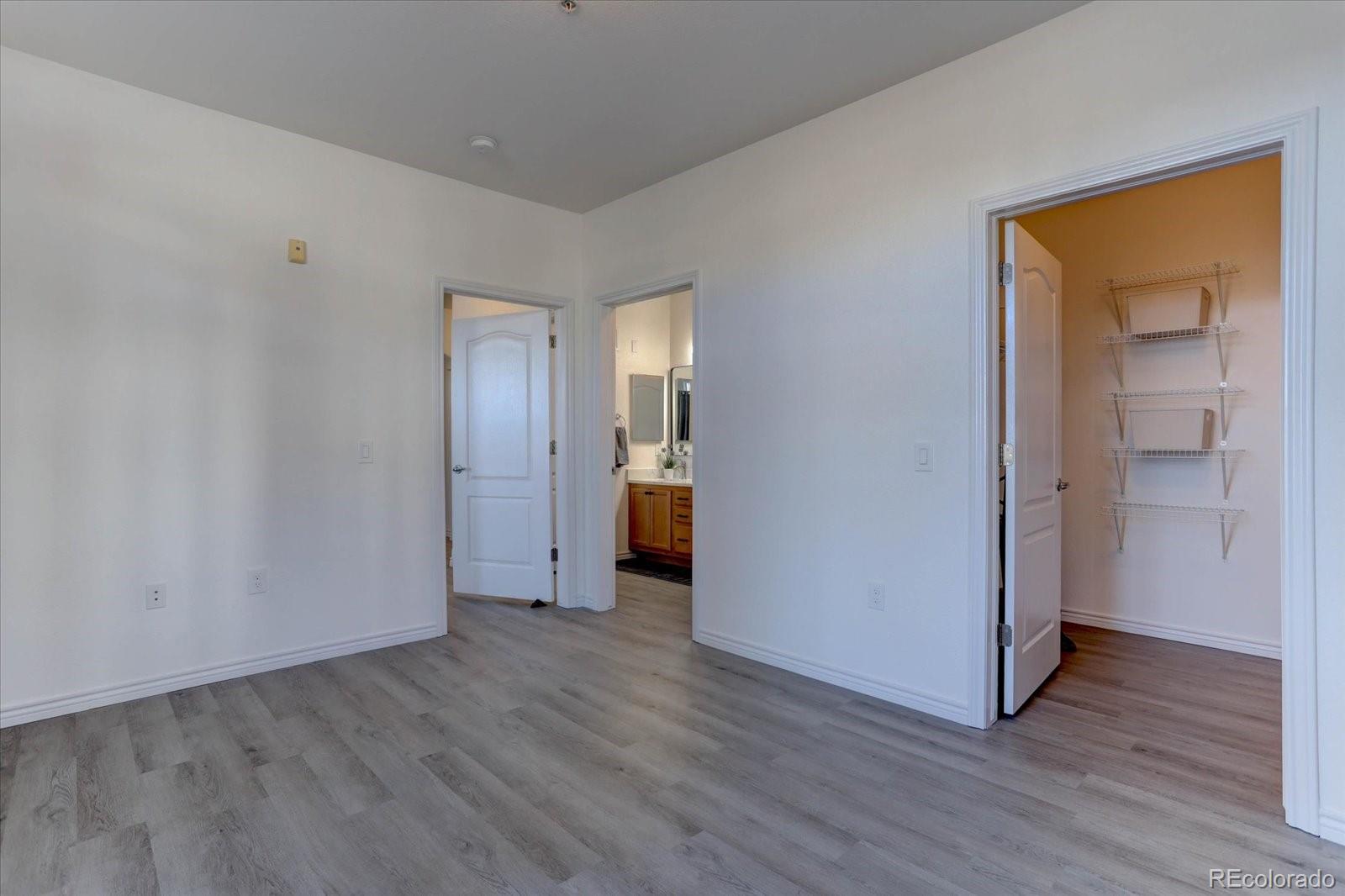 18657 Stroh Road, Unit 4107 Parker, CO 80134 - Photo 18 of 25 a view of a room with wooden floor