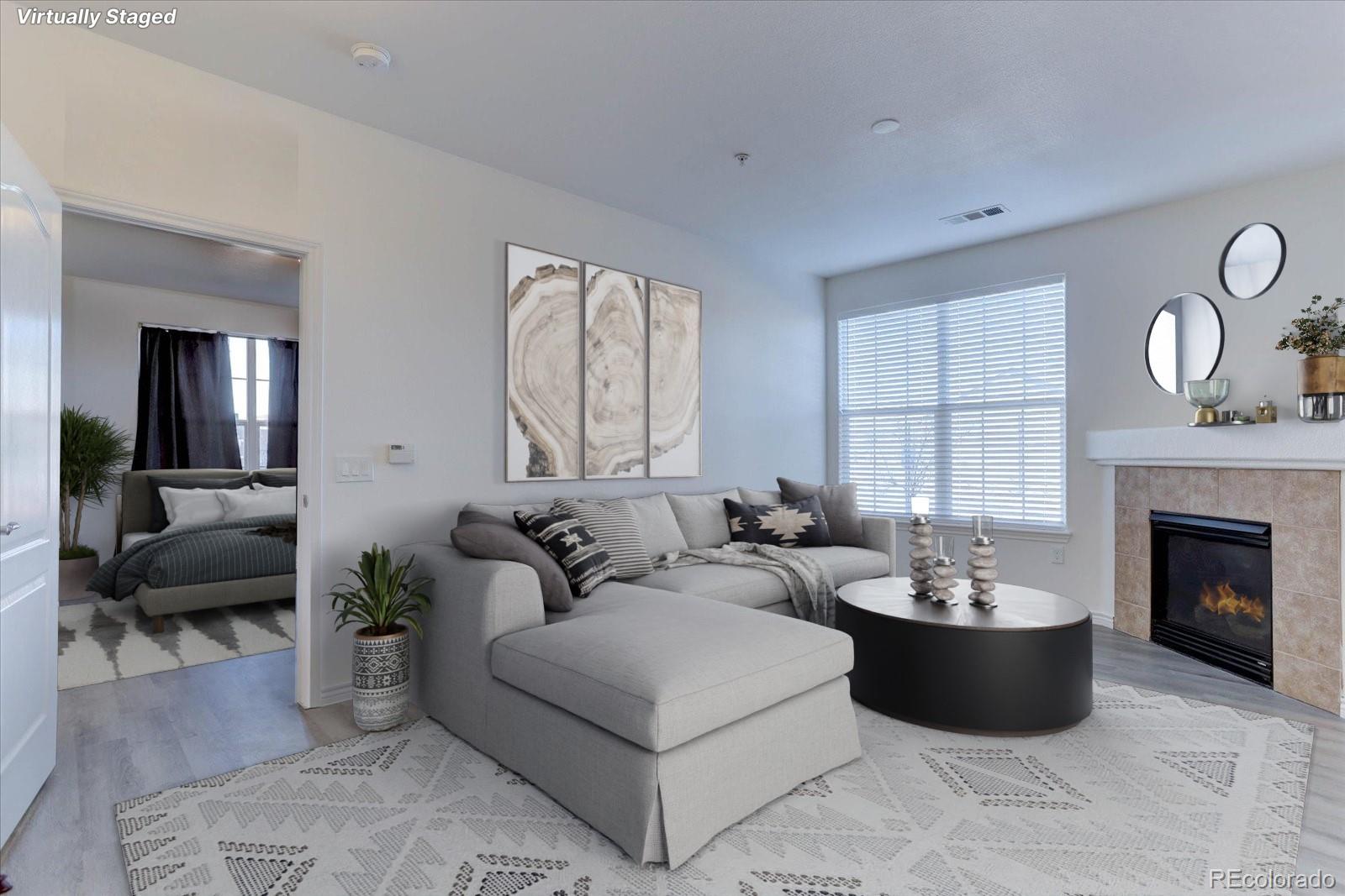 18657 Stroh Road, Unit 4107 Parker, CO 80134 - Photo 2 of 25 a living room with furniture and a fireplace