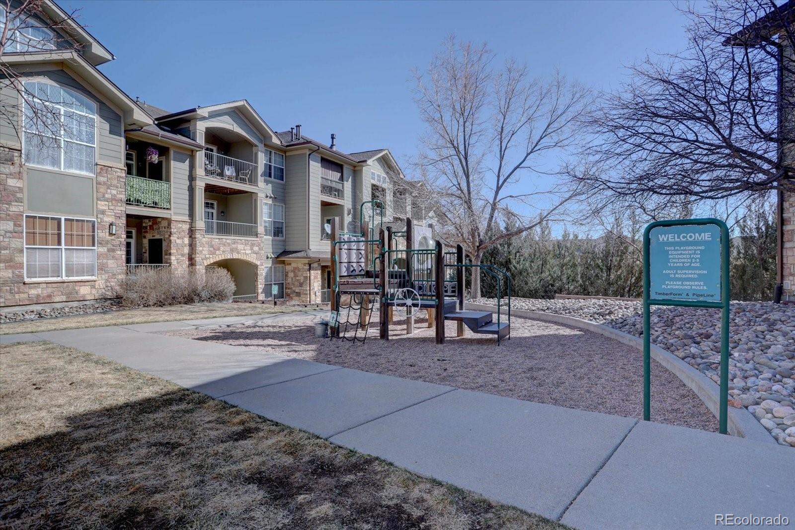 18657 Stroh Road, Unit 4107 Parker, CO 80134 - Photo 24 of 25 a front view of a house with a yard