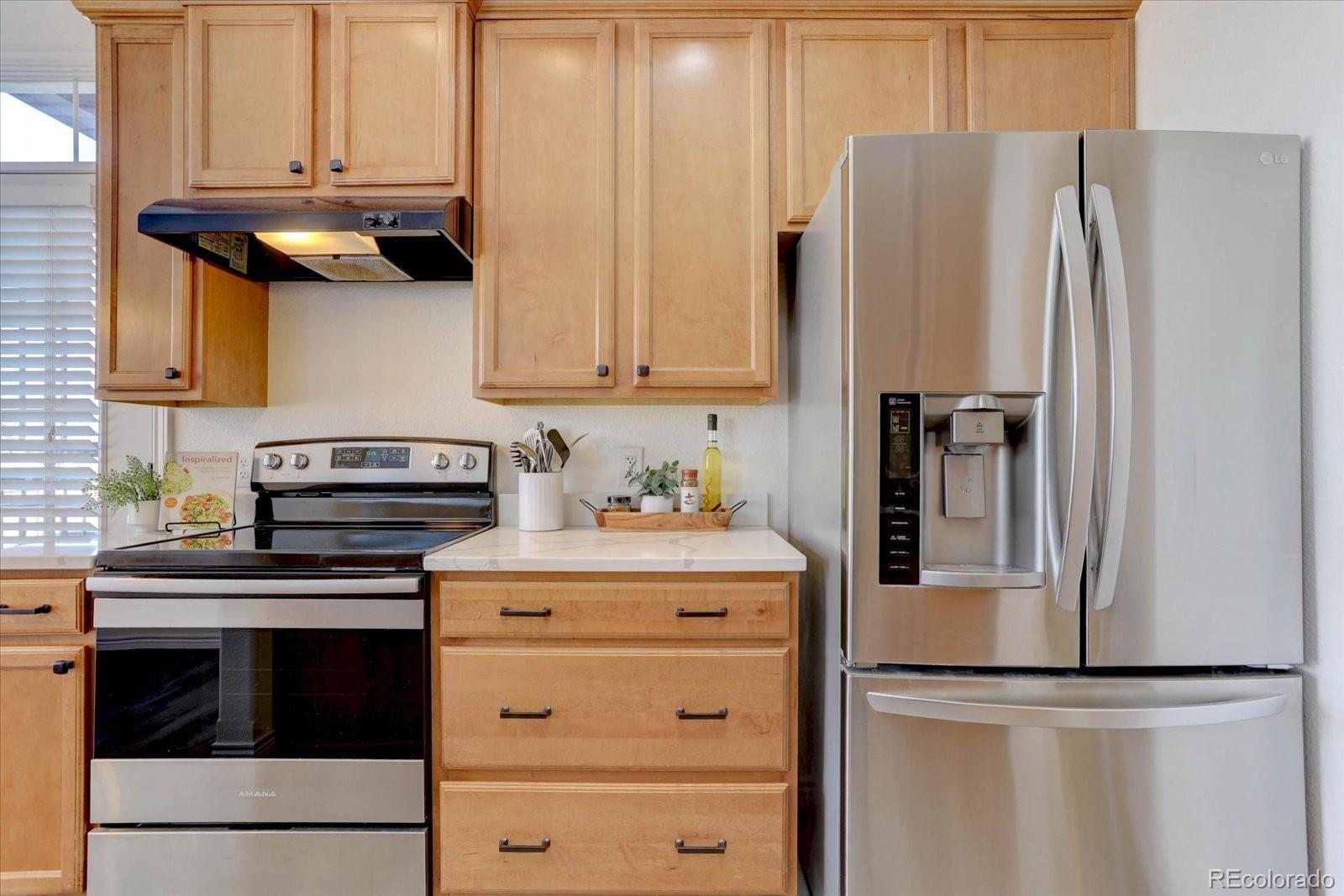 18657 Stroh Road, Unit 4107 Parker, CO 80134 - Photo 5 of 25 a kitchen with appliances and cabinets