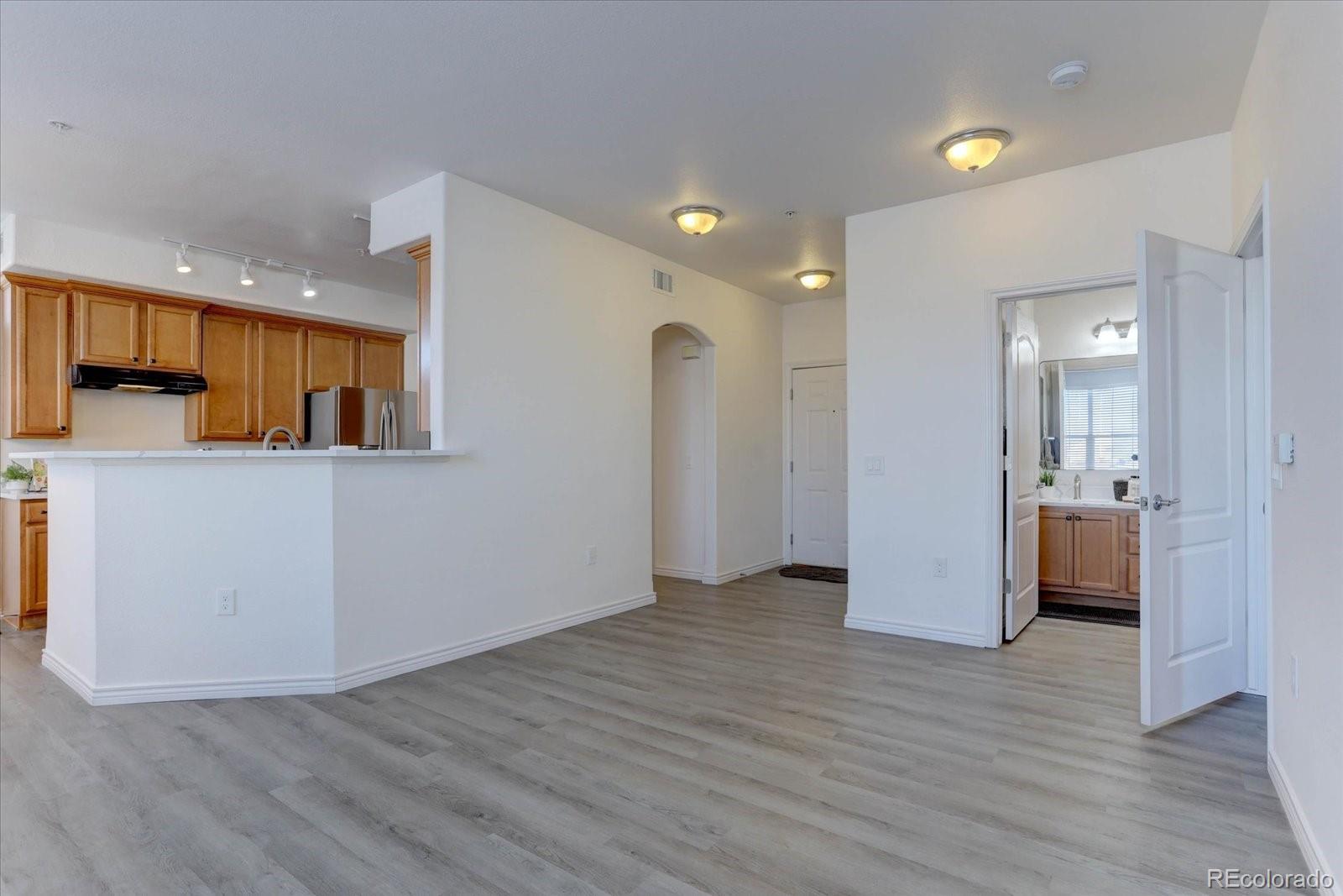 18657 Stroh Road, Unit 4107 Parker, CO 80134 - Photo 8 of 25 a view of a kitchen with a refrigerator and a stove