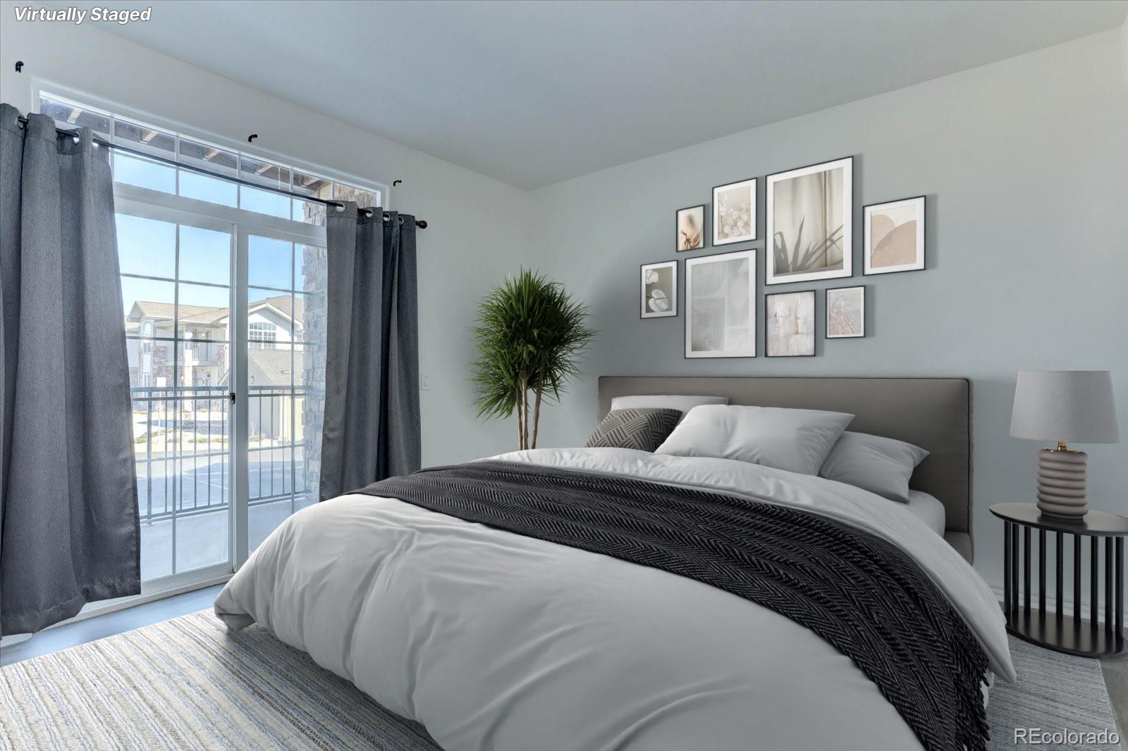 18657 Stroh Road, Unit 4107 Parker, CO 80134 - Photo 9 of 25 a bedroom with a large bed and a window