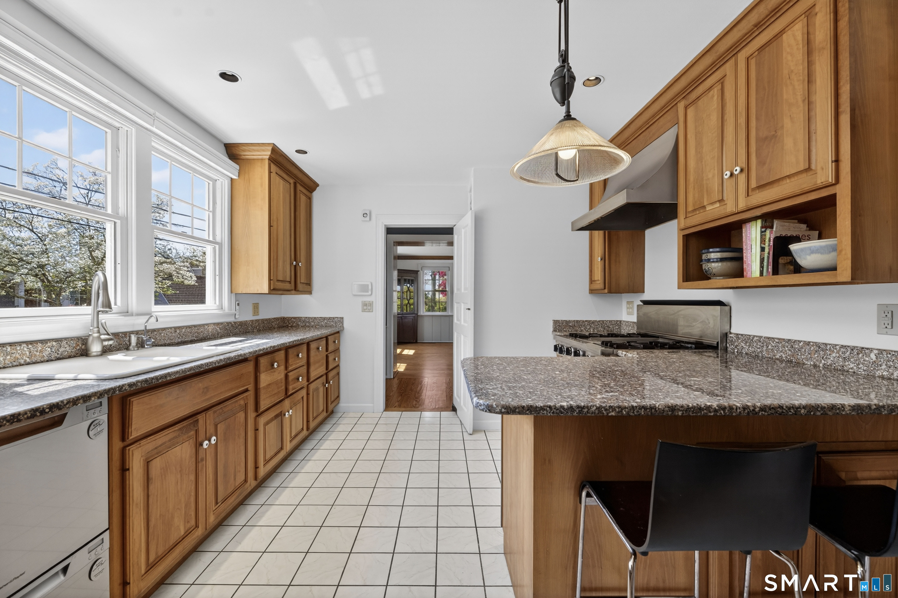 32 Money Point Road Stonington, CT 06355 - Photo 13 of 40 a kitchen with stainless steel appliances granite countertop a sink a stove and a wooden cabinets