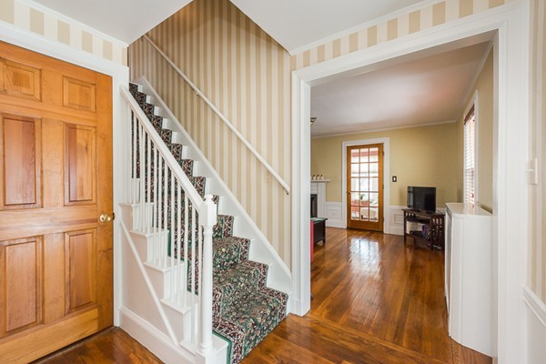 52 Emmonsdale Road Boston, MA 02132 - Photo 5 of 20 a view of front door with dining room and stairs