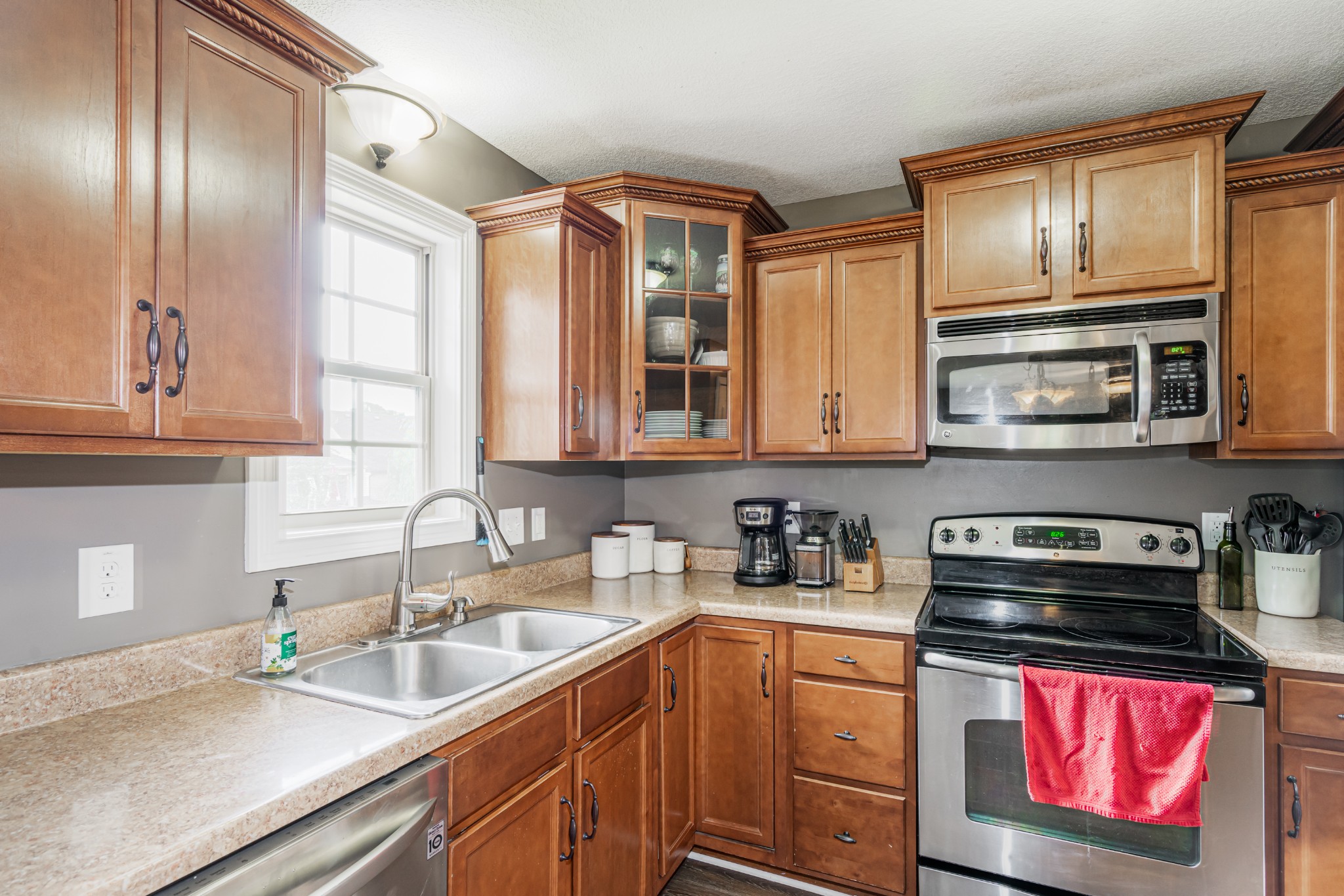 3735 Suiter Road Clarksville, TN 37040 - Photo 13 of 22 a kitchen with stainless steel appliances granite countertop a sink stove and cabinets