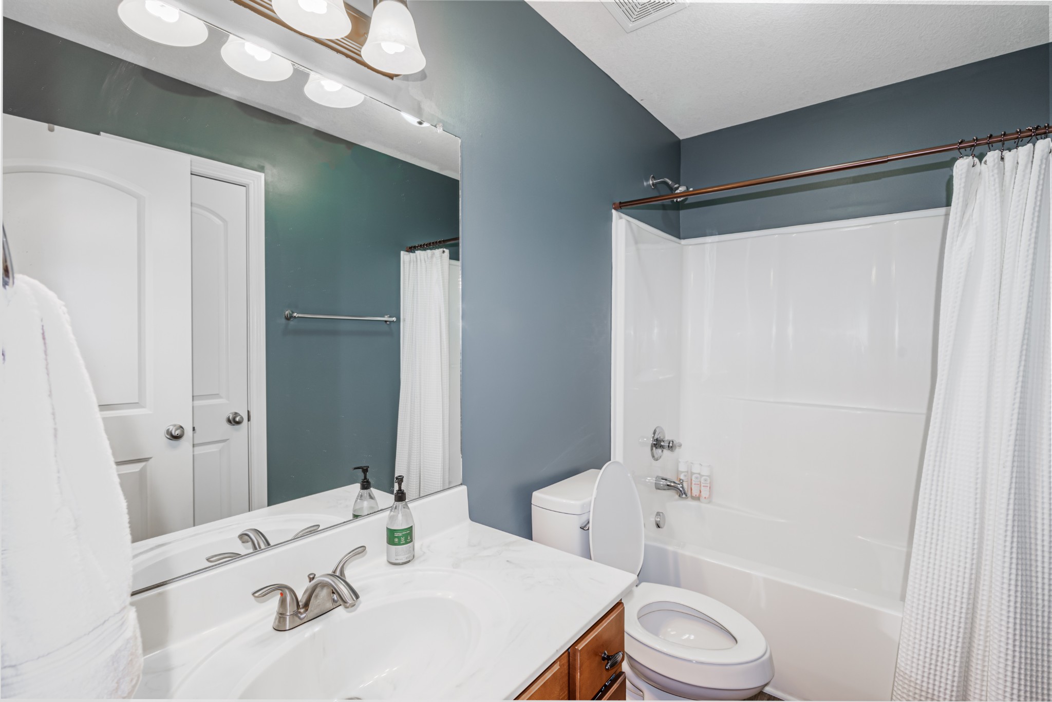 3735 Suiter Road Clarksville, TN 37040 - Photo 10 of 22 a bathroom with a sink toilet and shower