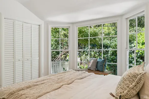 a view of a house with backyard sitting area and garden
