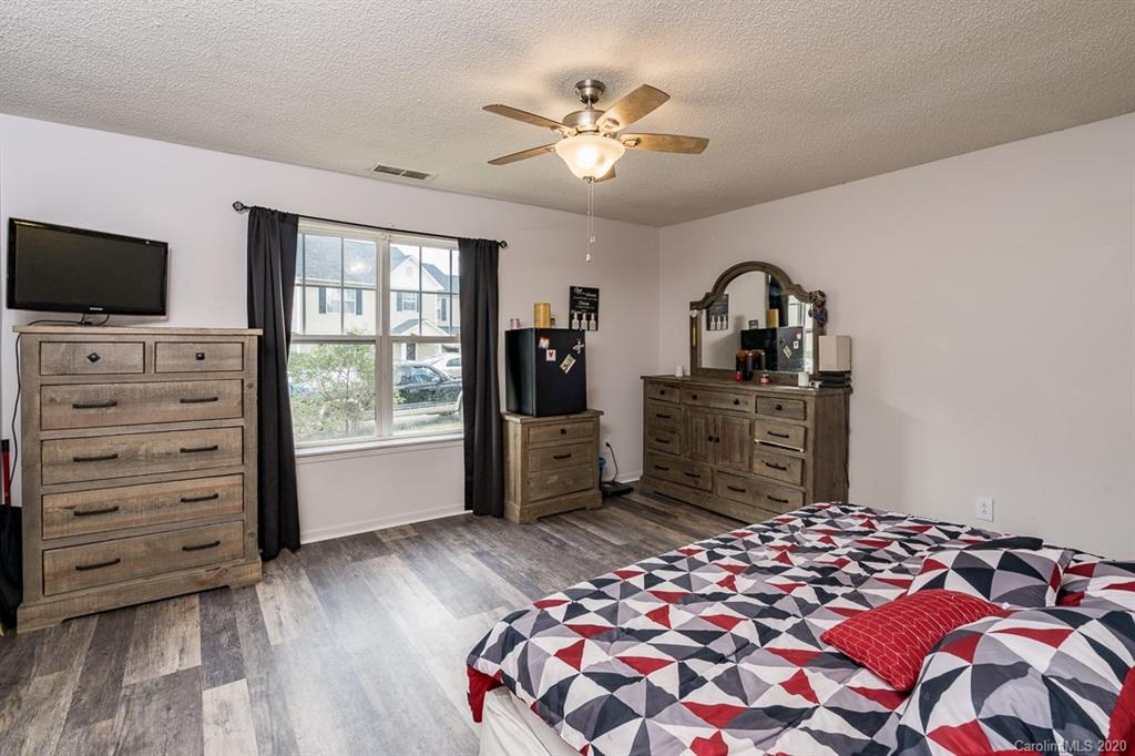 772 Raindrops Road Gastonia, NC 28054 - Photo 23 of 28 a bedroom with a bed and a television