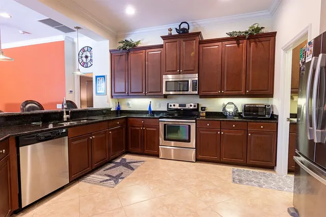 a view of a livingroom with furniture and a window