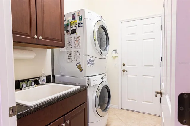 a bed room with a bed and a ceiling fan