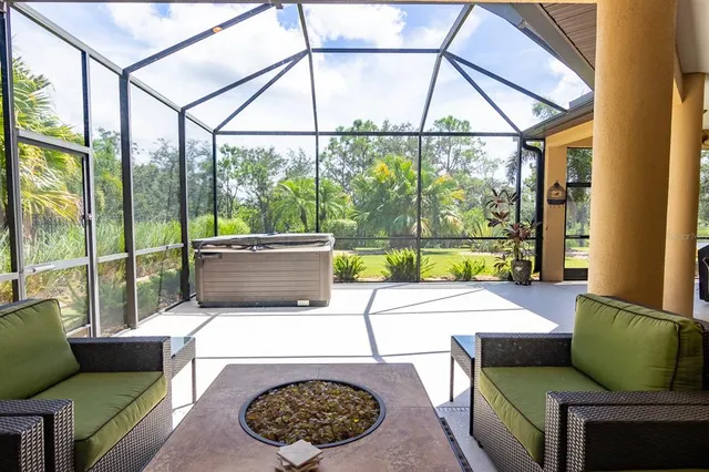 a view of a livingroom with furniture and a ceiling fan