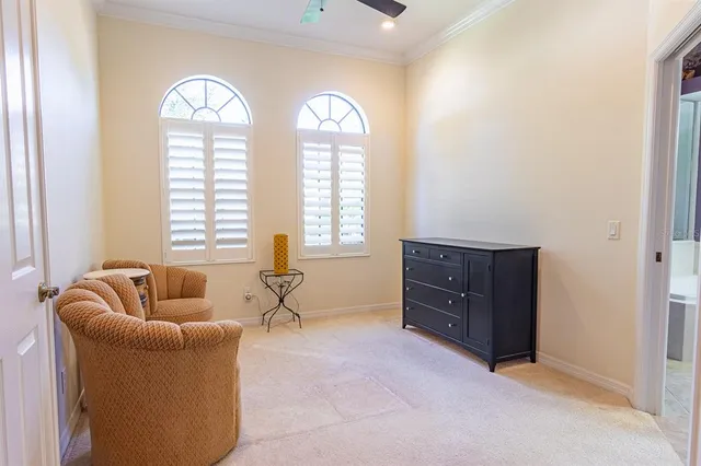 a view of an empty room with furniture and a cabinet