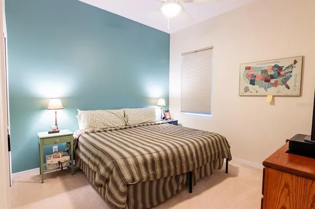 a bedroom with a bed and dresser